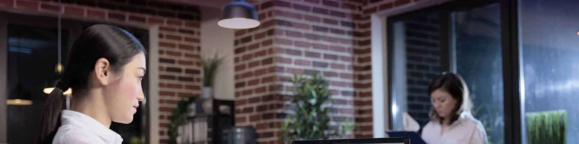 image of a woman working on a laptop